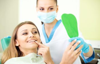 Patient checking hers nee teeth