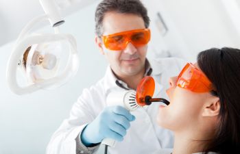 Dentist with orange galsses