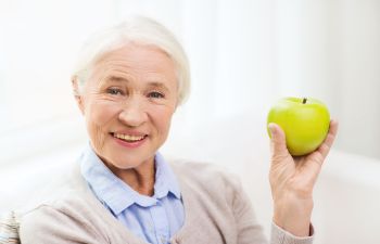 Old woman holding an apple Johns Creek, GA