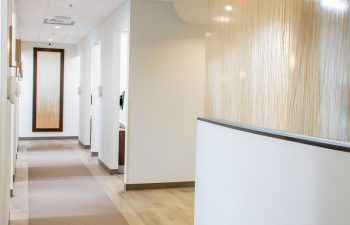 Curved reception counter along the treatment area hallway